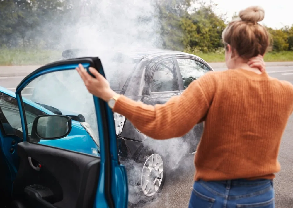 Two cars smoking after an accident