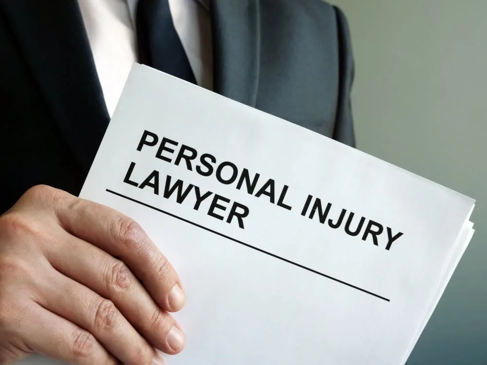 Person holding personal injury documents