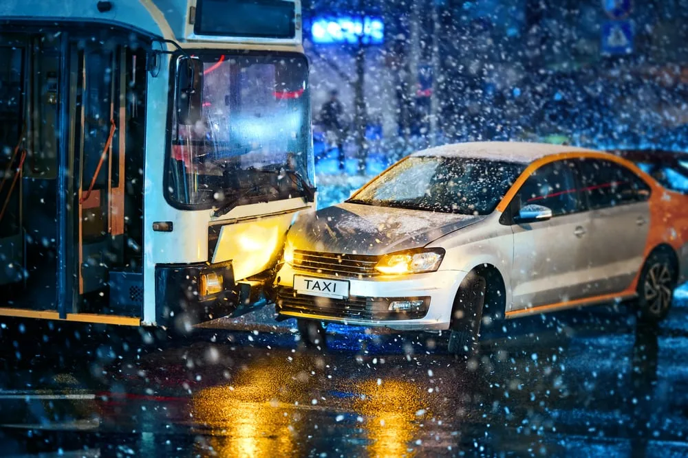 Collision of a bus and a car in bad weather